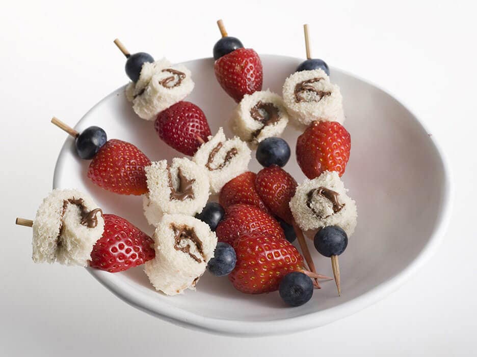 Nutella pastry scrolls served with berry skewers and mascarpone dip.