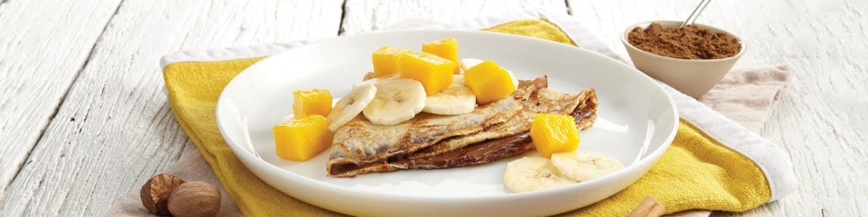 Spiced pancakes stacked with Nutella, orange zest and cinnamon sugar.