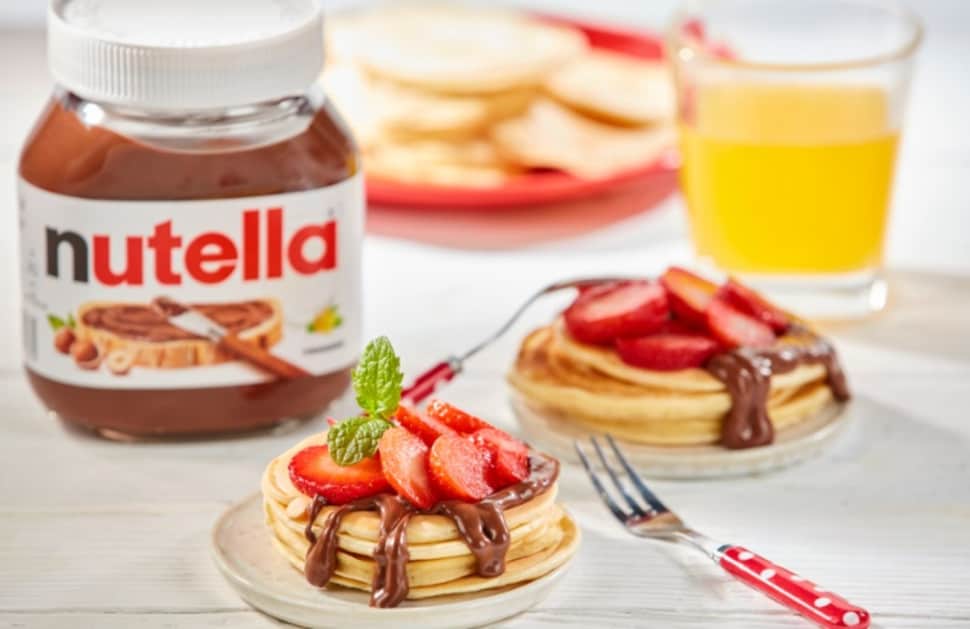 Yoghurt pancakes with strawberries and Nutella swirl, served warm.