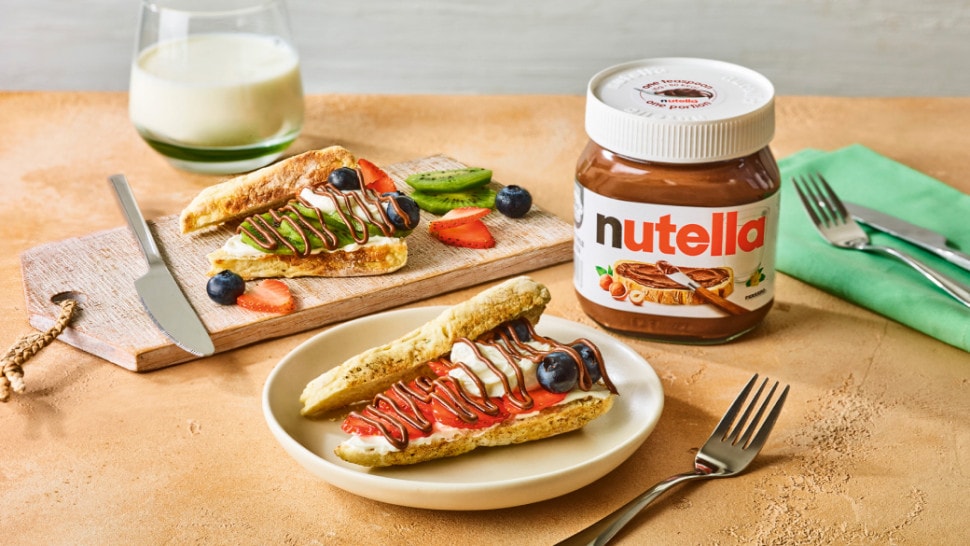 Nutella® strawberry and blueberry soda bread farls served with fresh fruit, crème fraîche, and a Nutella® jar.