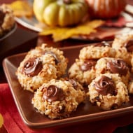 Thumbprint cookies filled with Nutella and dusted with powdered sugar.