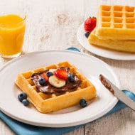 Waffle topped with Nutella and festive decorations.