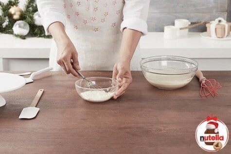 Cheesecake step showing Nutella mixture being spread onto the wrap.